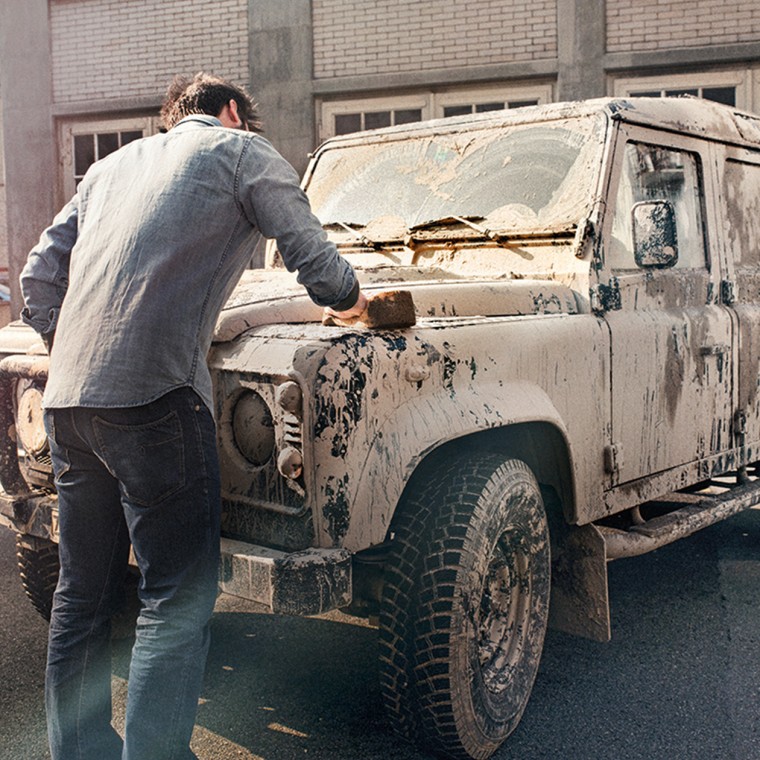 Man cleaning a car