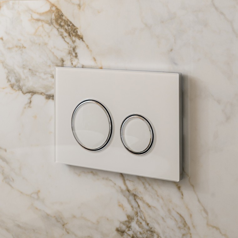 White Geberit Sigma50 actuator plate with design rings in silver White Geberit Sigma50 actuator plate with design rings in silver