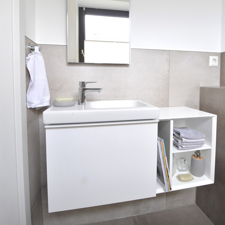 View of the guest bathroom with washbasin and cabinets View of the guest bathroom with washbasin and cabinets