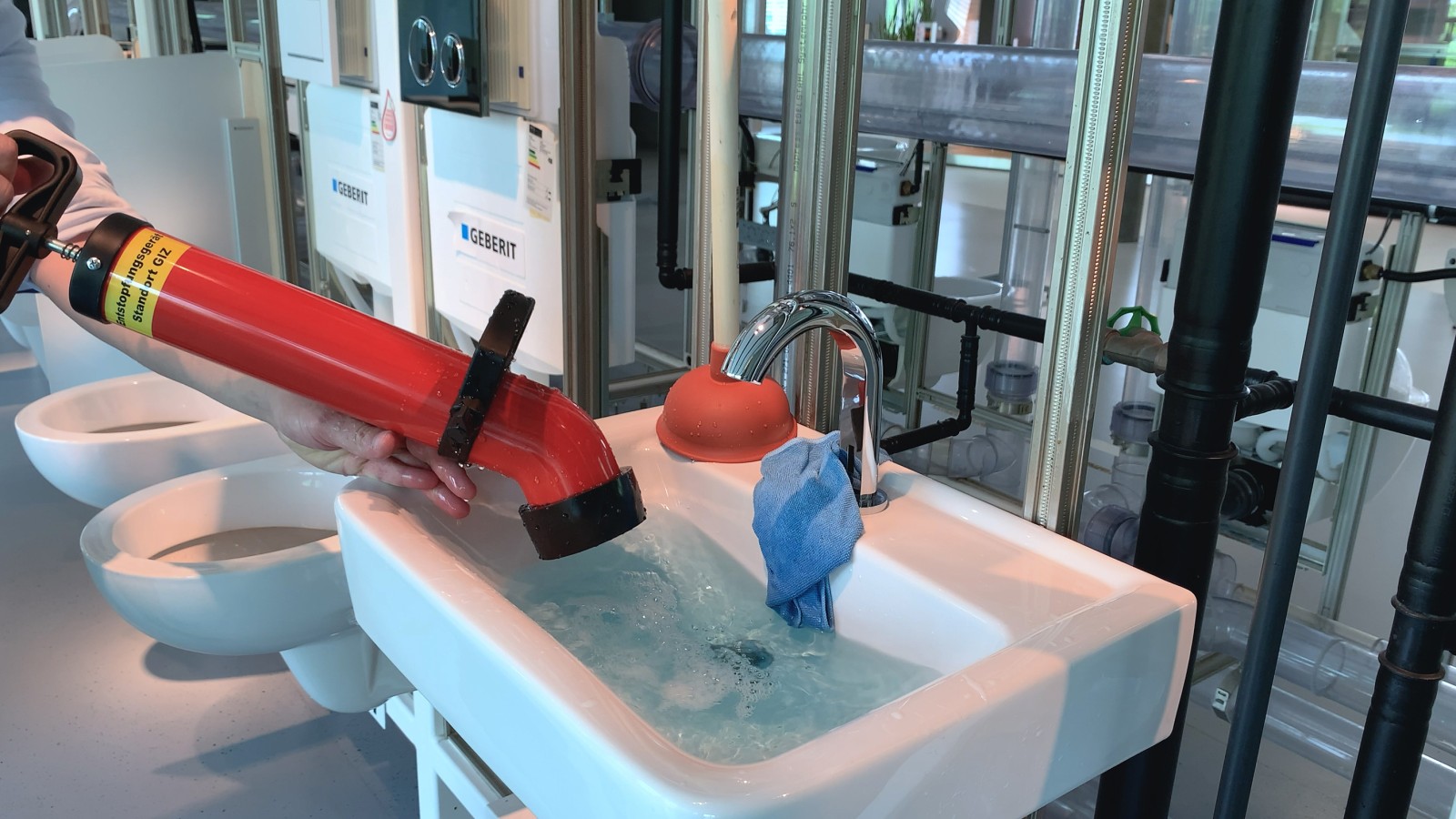 A pressure pipe cleaner in use