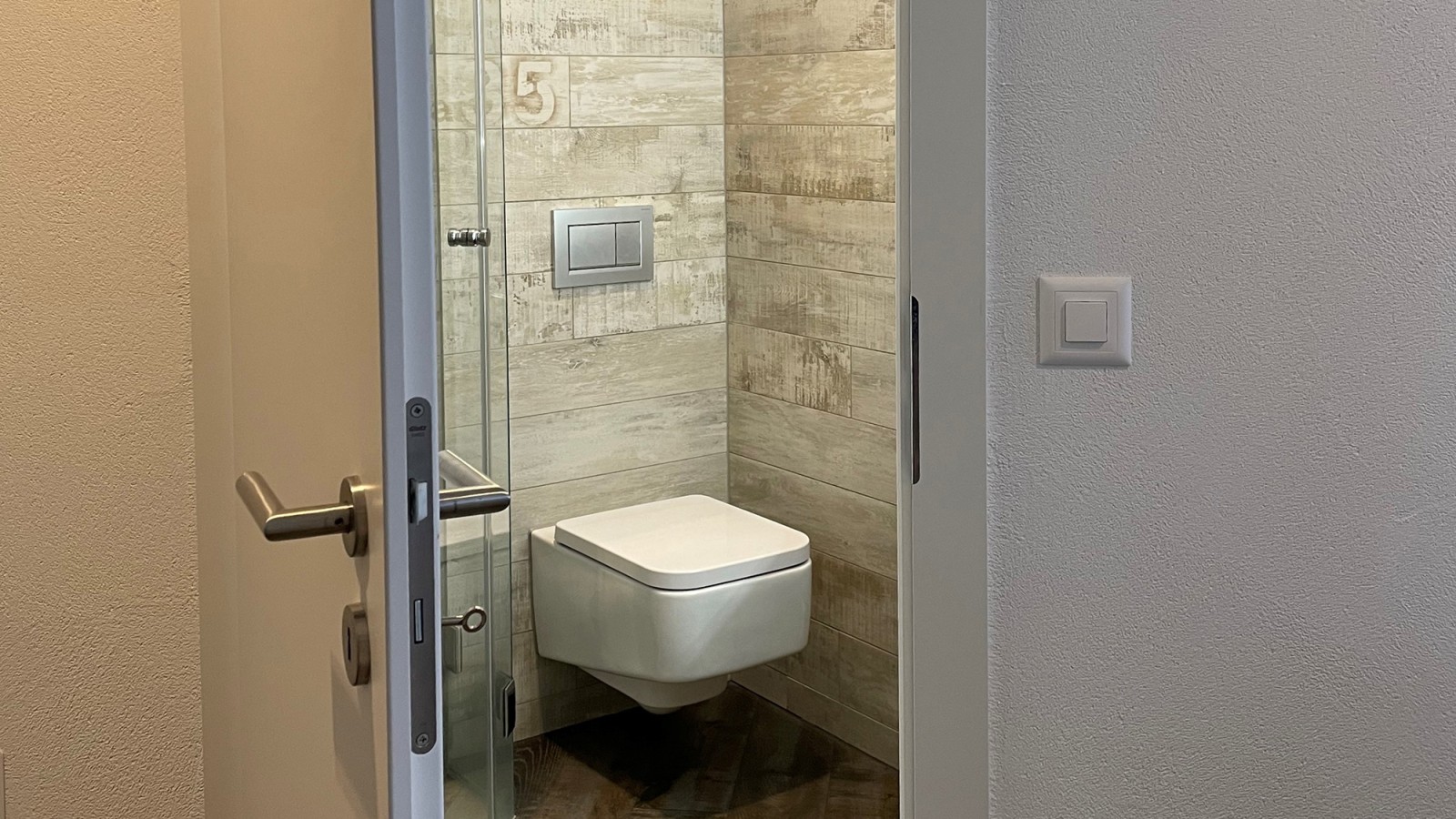 Bathroom door that opens outwards