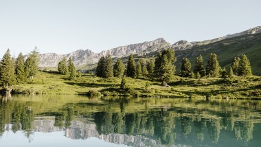 Reflections in the Swiss mountain lake Engstlensee at 1,835 metres above sea level. Photographer: Bruno Augsburger (© Geberit)