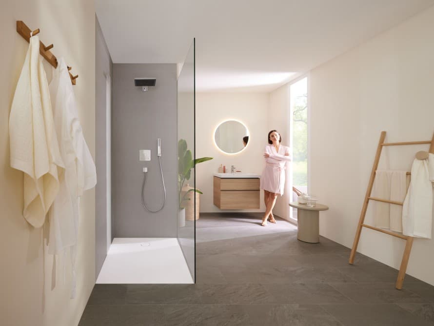 Woman in bathroom with shower Woman in bathroom with shower