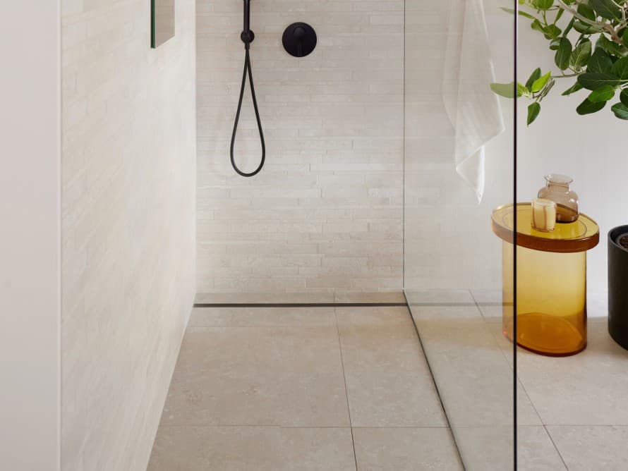 Bathroom with large tiles and floor-even shower Bathroom with large tiles and floor-even shower