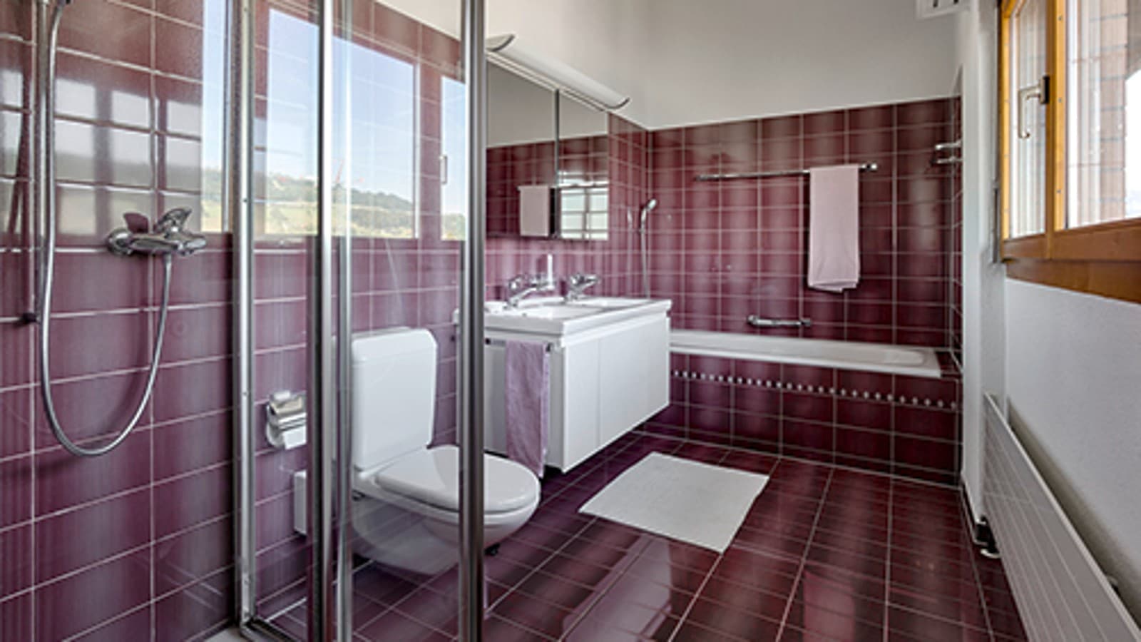 Bathroom before renovation with red tiles Bathroom before renovation with red tiles